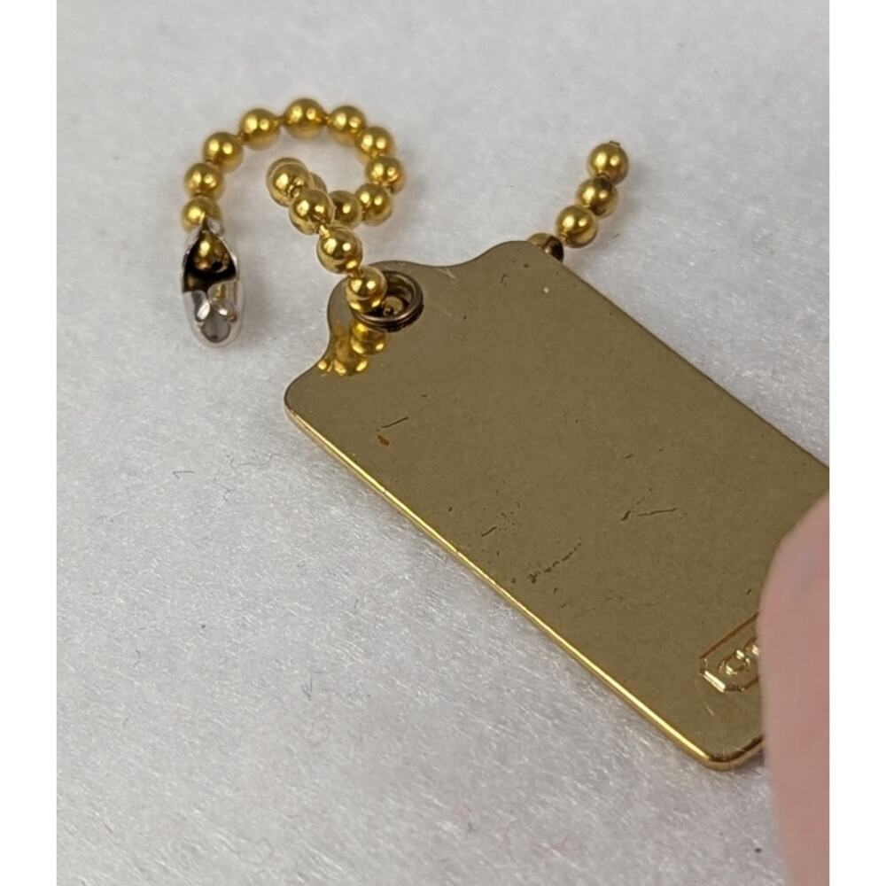 Coach metal bag tag goldtone Stagecoach 1 34" x 7/8"Ball chain included EUC - Picture 4 of 6